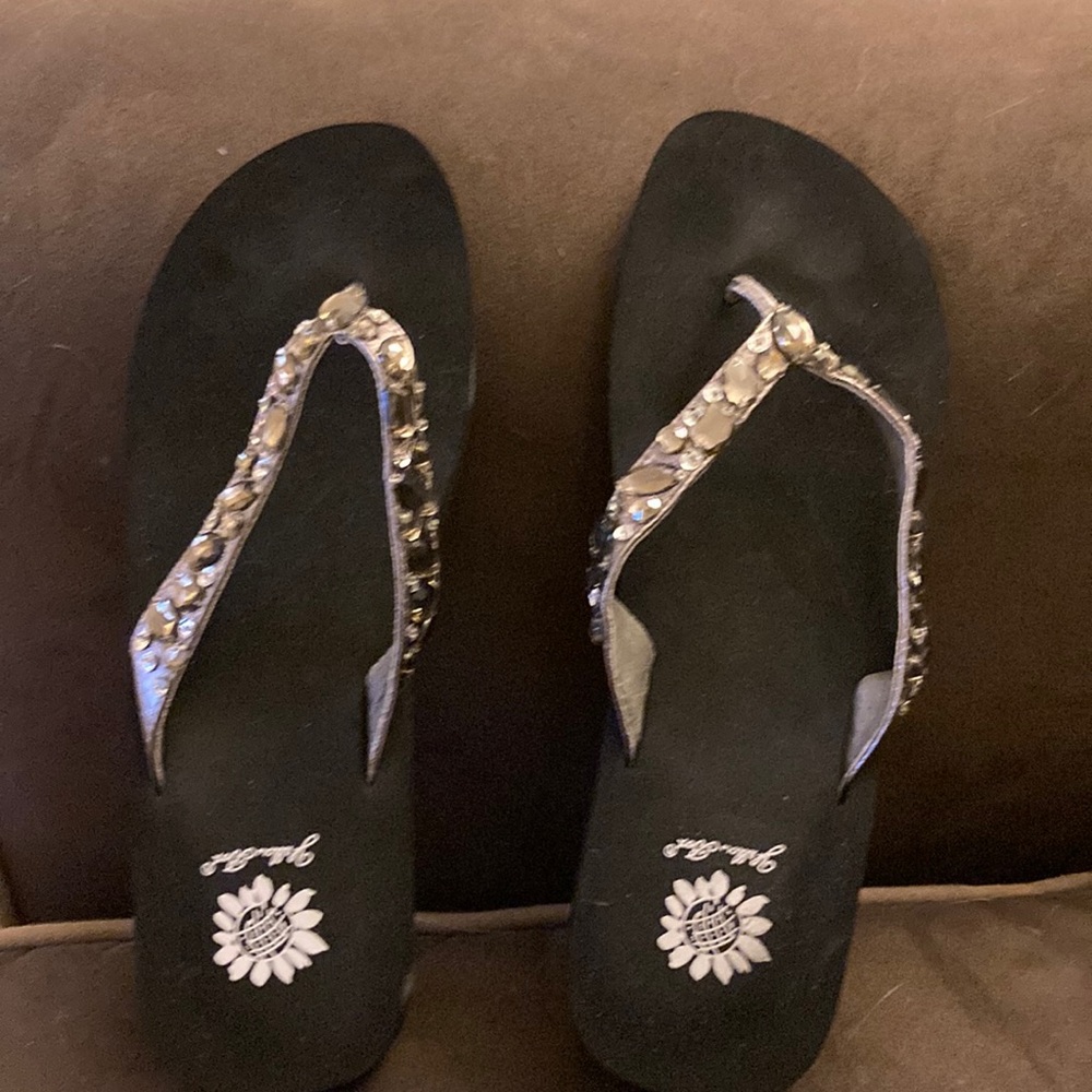 Black flip flops with silver studded straps